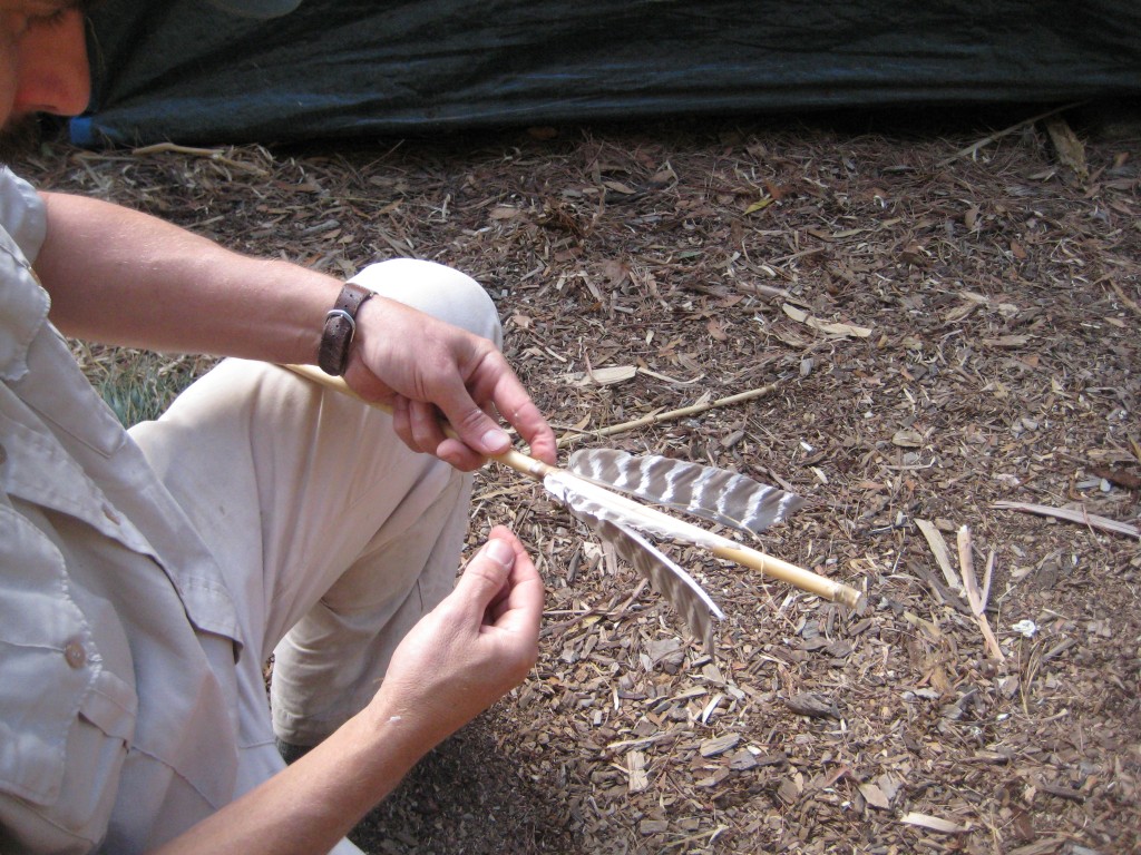 adding feathers to the dart